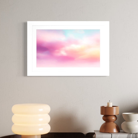 Candy Clouds pastel sky art framed and shown on a wall above a curved wood credenza with a bubble lamp