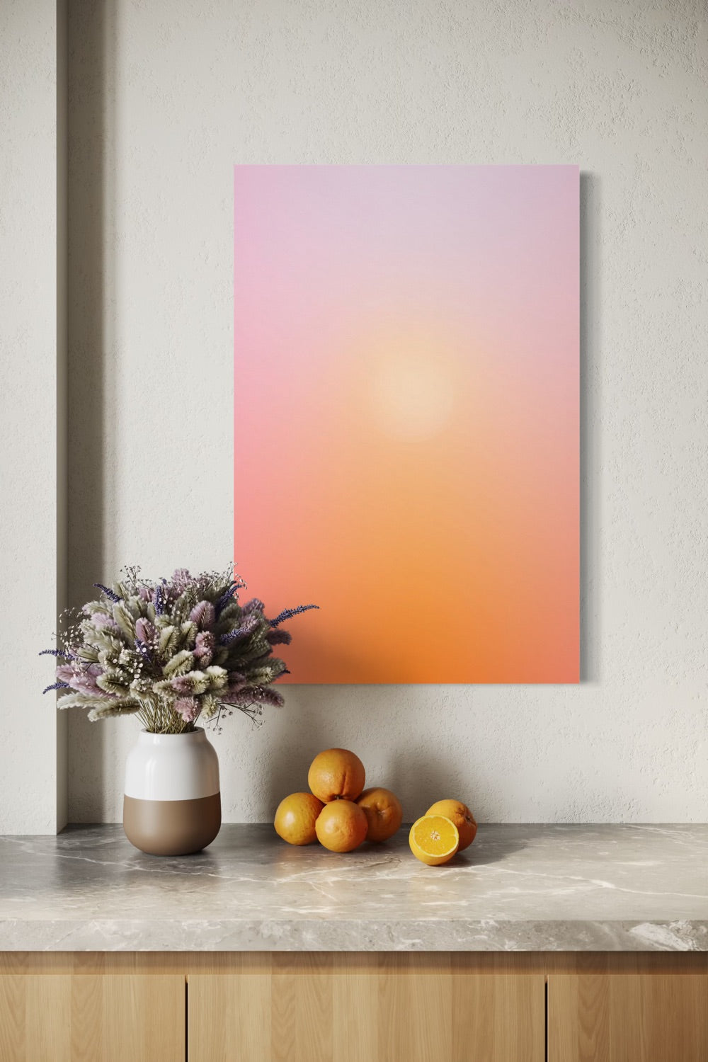 Golden Hour aura gradient canvas shown to scale above a wood credenza with dried lavender and oranges
