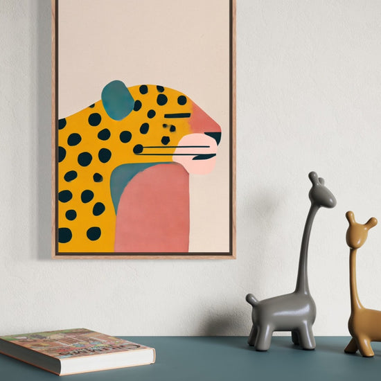 Jaguar illustration in an oak frame shown on a wall above a teal sideboard with giraffe figurines