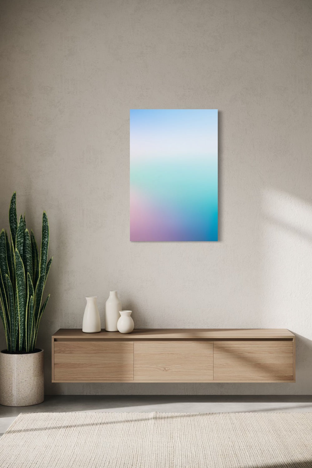 Ocean Calm aura gradient canvas shown on a wall above a light oak floating console with ceramic vases