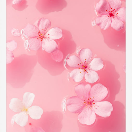Petal Gelée II framed art print: pastel blossoms drifting on blush water